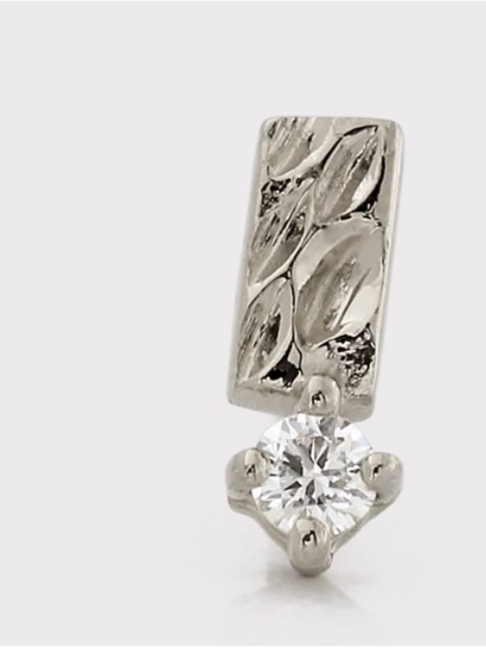Suzanne Kalan “Shooting Baguette” earring in 14k white gold with diamond.